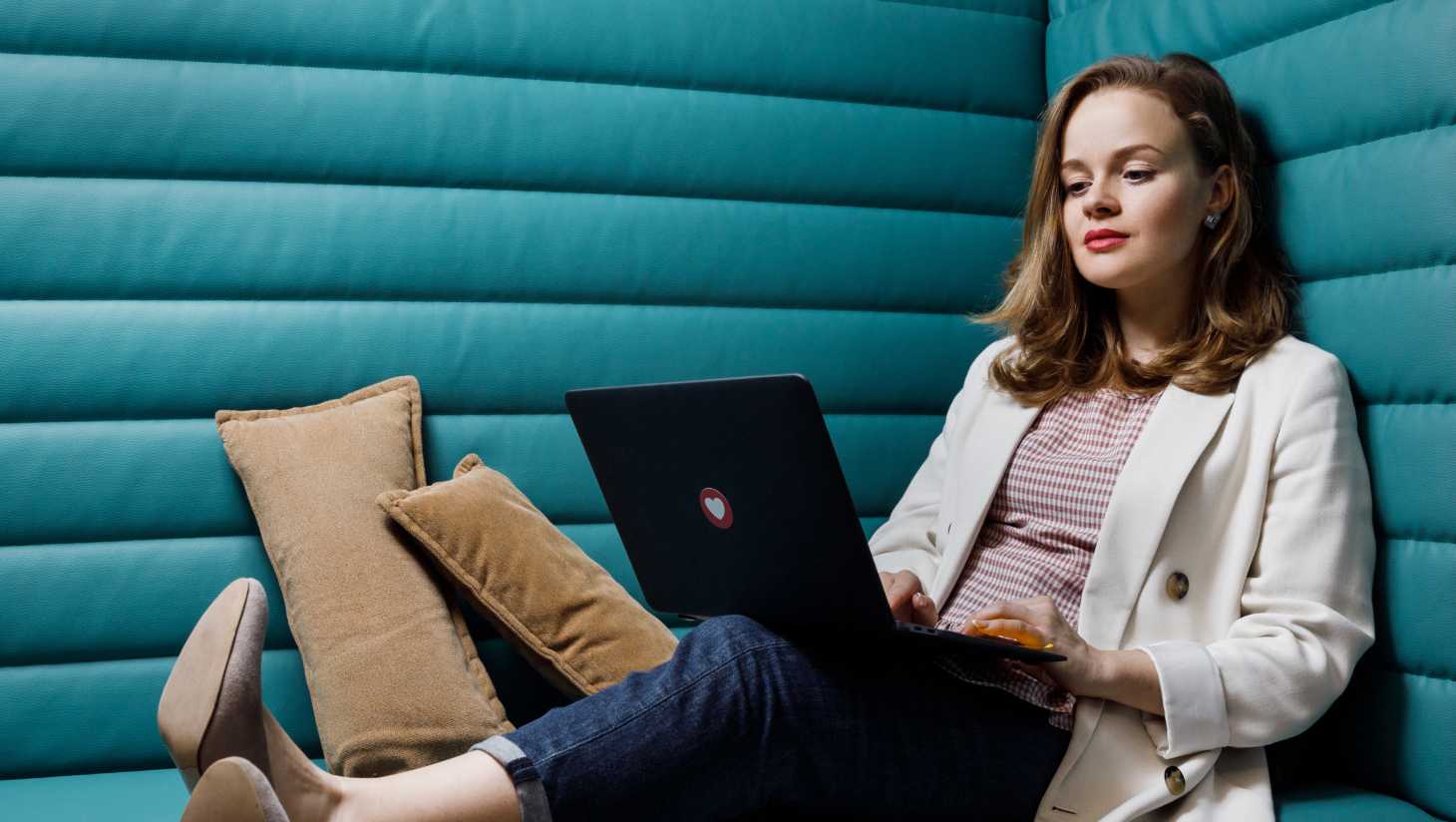 Woman sitting with a laptop